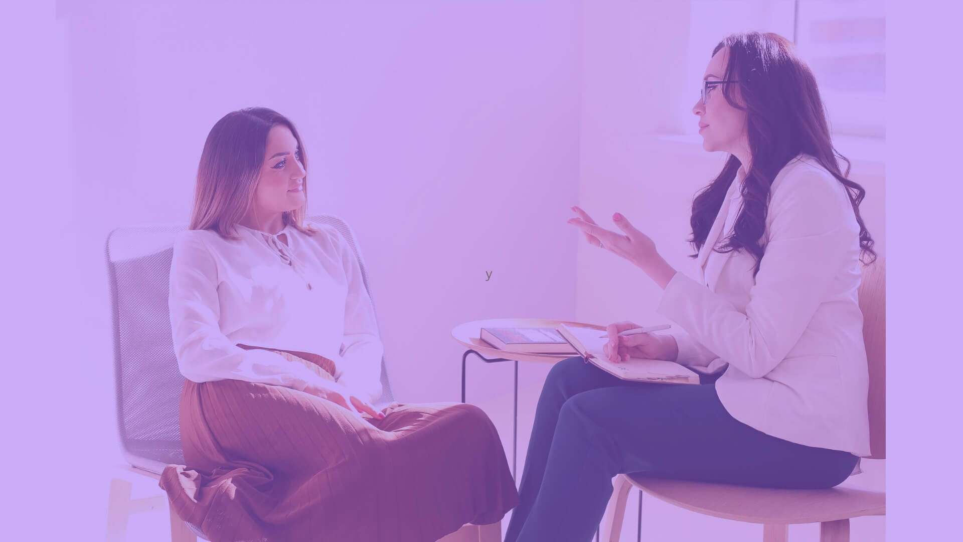 A life coach engaged in a conversation with a client